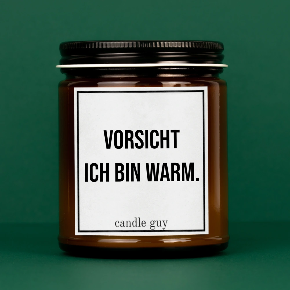 Brennende braune Kerze mit Spruch "Vorsicht ich bin warm."