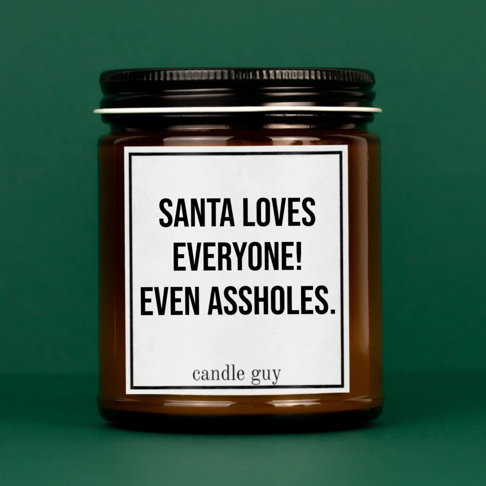Brennende braune Kerze mit Spruch "Santa loves everyone! Even assholes."