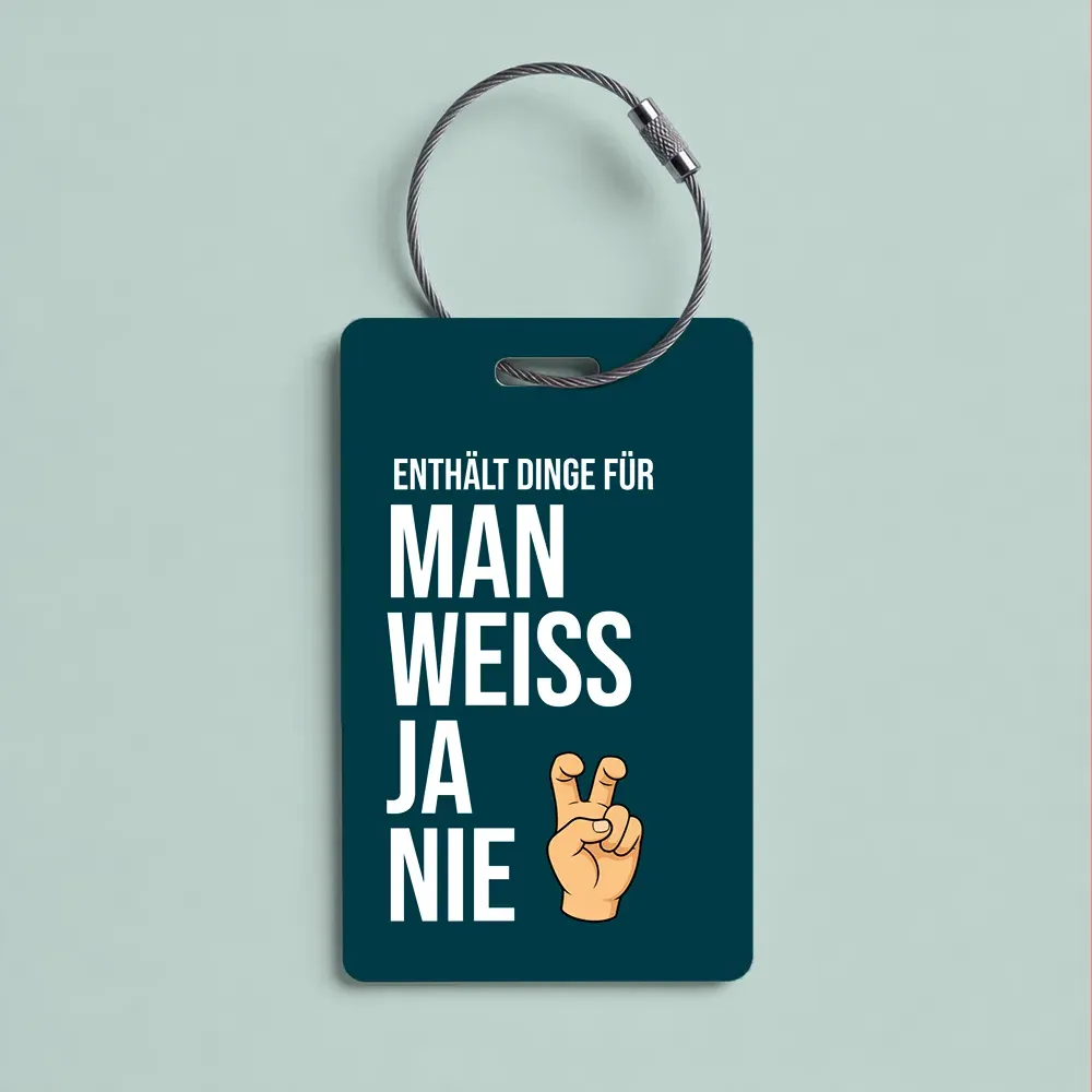Dark teal tag on a metal cord with the German phrase 'Enthält Dinge für man weiss ja nie' and a crossed-fingers emoji, conveying 'you never know'.