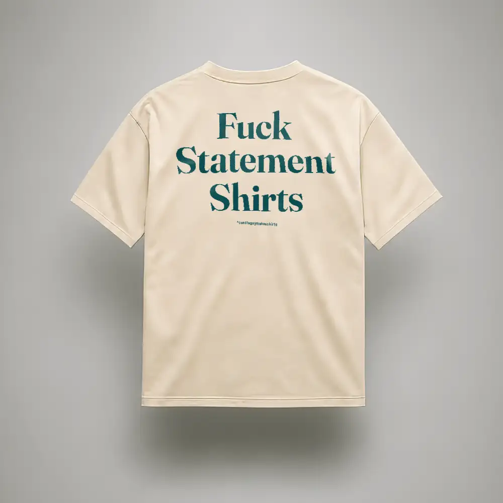 Beige T-shirt shown from the back with teal text reading 'Fuck Statement Shirts'.